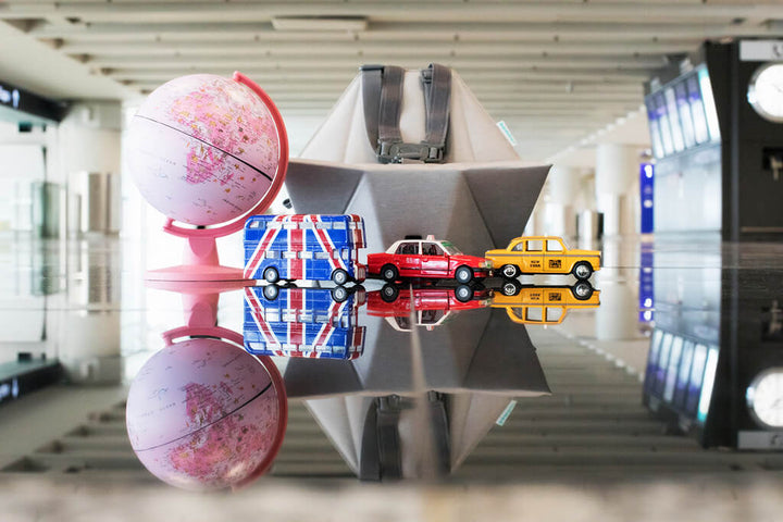 Bombol Pop-Up Booster with toy cars and globe in airport
